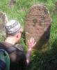 Irwin Keller try to decipher a hebrew date on grave of Miriam daughter of Eliezer Perlis
